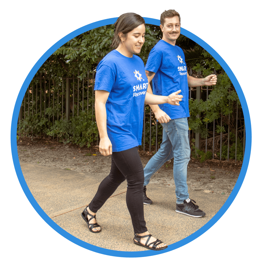 Unite For Recovery participants walking together wearing blue SMART Recovery t-shirts